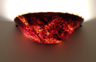 Glass tortoise shell wall sconce by Trish Odenthal